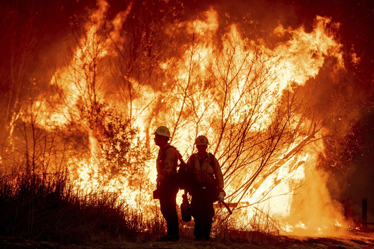 Fire crews battle the Kenneth Fire on Thursday in the West Hills section of Los Angeles.