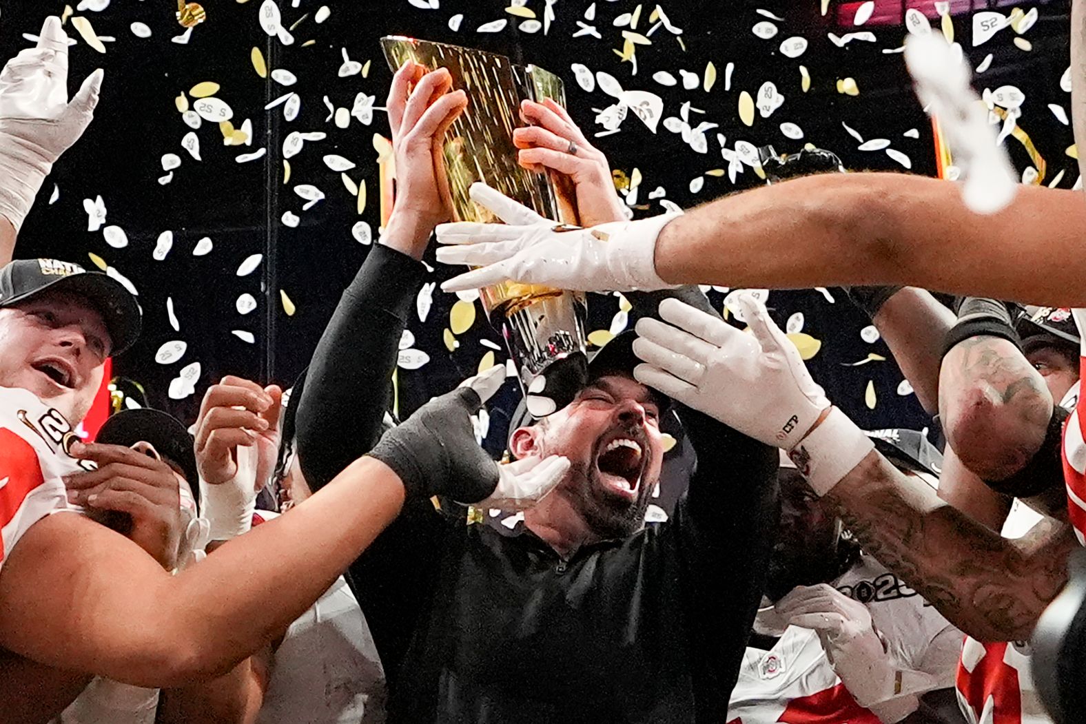 Ohio State head coach Ryan Day celebrates with the trophy after the Buckeyes defeated Notre Dame <a href="index.php?page=&url=https%3A%2F%2Fwww.cnn.com%2F2025%2F01%2F21%2Fsport%2Fohio-state-wins-national-championship-spt%2Findex.html">to win college football’s national championship game</a> on Monday, January 20. It is Ohio State’s first national title since the 2014 season.