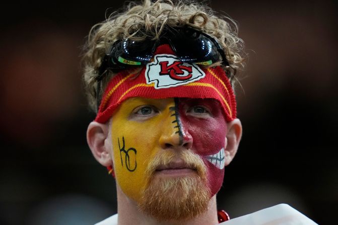 A Chiefs fan watches from the Superdome.