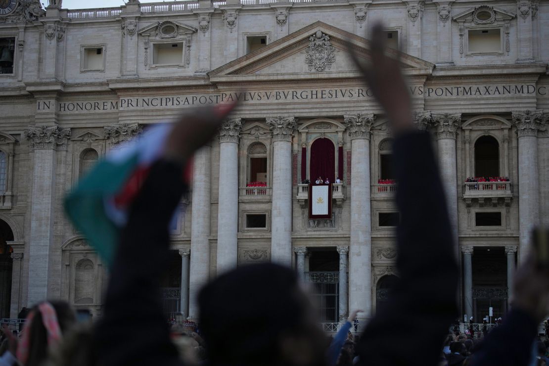 Faithful react as the newly elected Pope Leo XIV appears at the balcony of St. Peter's Basilica on Thursday.