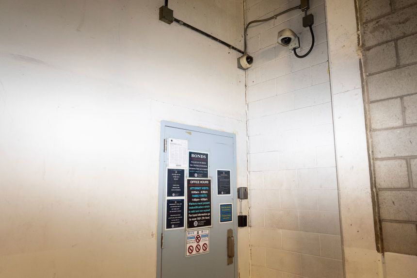 Surveillance cameras hang above the entrance to a US Immigration and Customs Enforcement facility where immigration hearings take place, in Los Angeles on July 25.