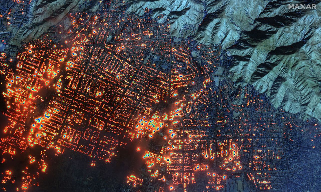A satellite image shows that the Eaton wildfire has set nearly every building in western Altadena on fire.