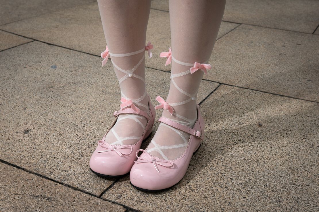 Liang has paid attention to detail, donning ballerina-like tights and baby pink Mary Janes.