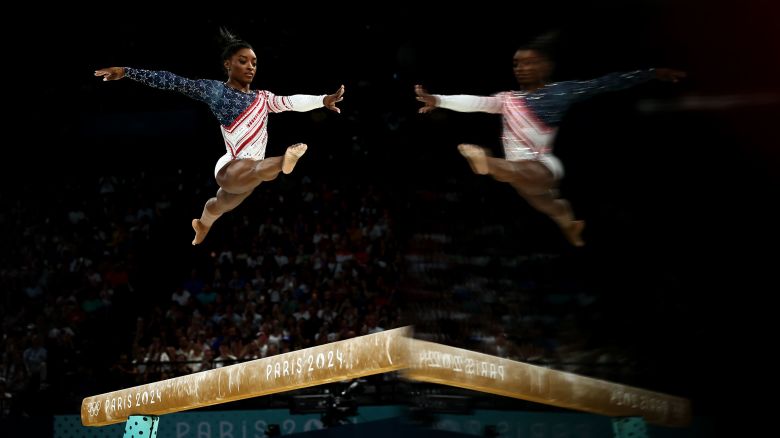 PARIS, FRANCE - JULY 30: Simone Biles of Team United States competes on the balance beam during the Artistic Gymnastics Women's Team Final on day four of the Olympic Games Paris 2024 at Bercy Arena on July 30, 2024 in Paris, France. (Photo by Naomi Baker/Getty Images)