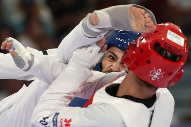 Jordan's Zaid Abdul Kareem, left, competes against Turkey's Hakan Reçber during a taekwondo quarterfinal on August 8.