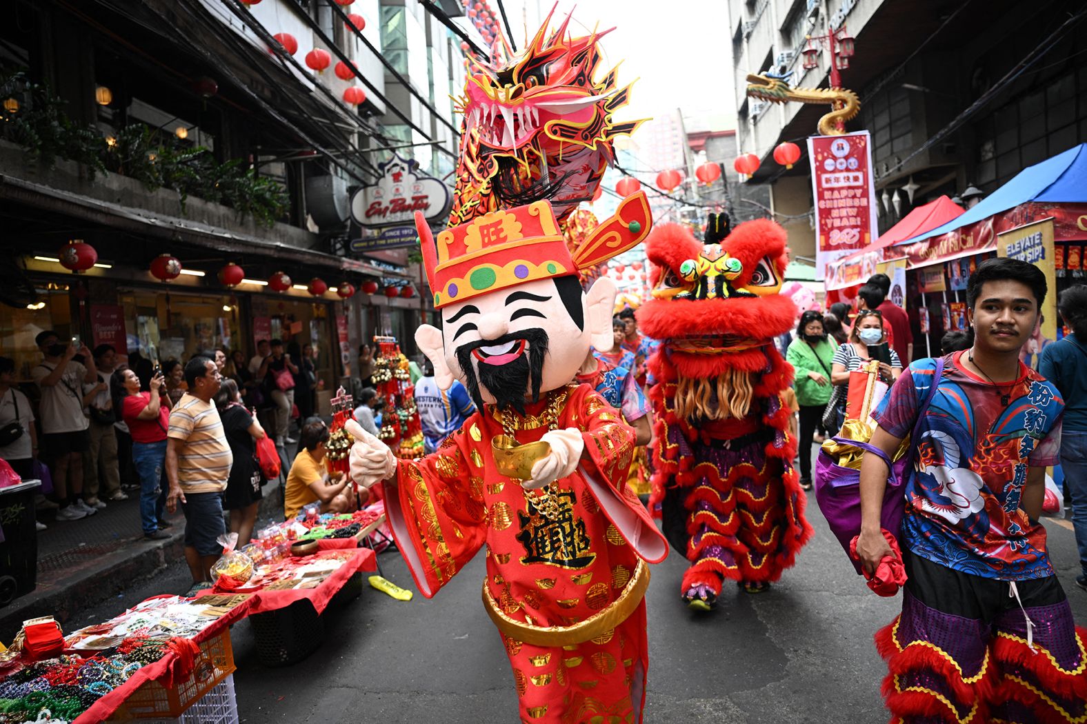 Dragon and lion dancers take part in a procession in the Chinatown district of Manila, Philippines, on the eve of the Lunar New Year of the Snake on Tuesday.