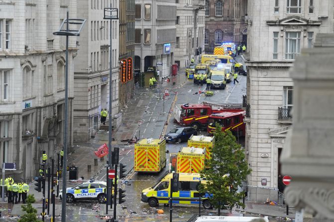 Emergency personnel work at the scene where <a  target="_top" href="/newspapers?url=https://www.cnn.com/2025/05/26/europe/liverpool-car-hits-pedestrians-latam-intl">a driver plowed a car into a parade</a> in Liverpool, England, on Monday, May 26. Dozens were injured in the incident, which came as fans crammed the streets to celebrate the Liverpool Football Club’s latest Premier League title. A 53-year-old man, believed to be the driver, <a  target="_top" href="/newspapers?url=https://www.cnn.com/2025/05/27/uk/liverpool-parade-collision-incident-explainer-gbr-intl">was arrested</a> and charged.