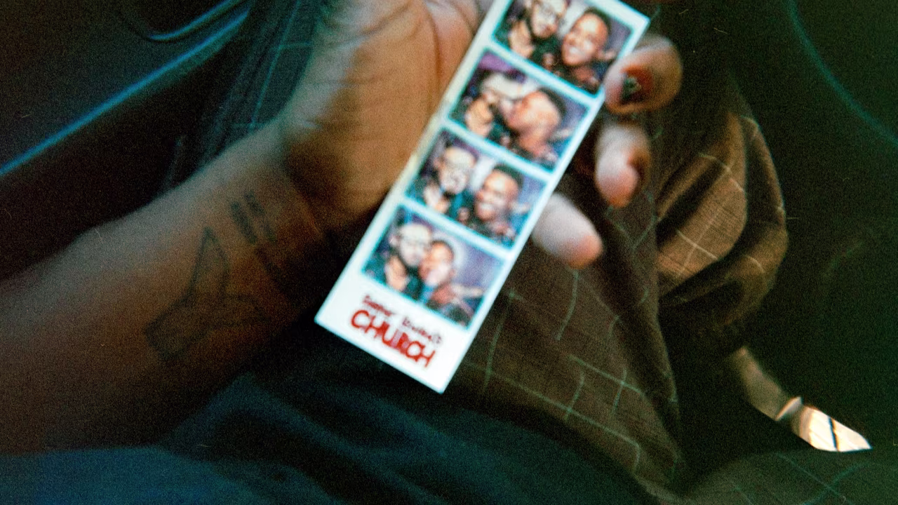 A strip of pictures from a photo booth shows Taylor Alxndr and their husband, Lawrence, a fellow drag artist.