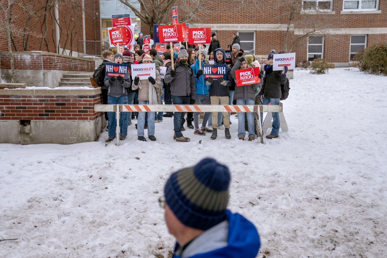 Haley supporters cheer as voters enter a polling site in Manchester, New Hampshire.