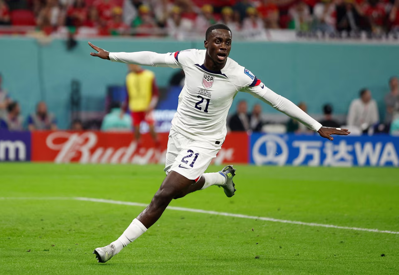 USA's Timothy Weah celebrates after scoring the first goal of the match against Wales on November 21.