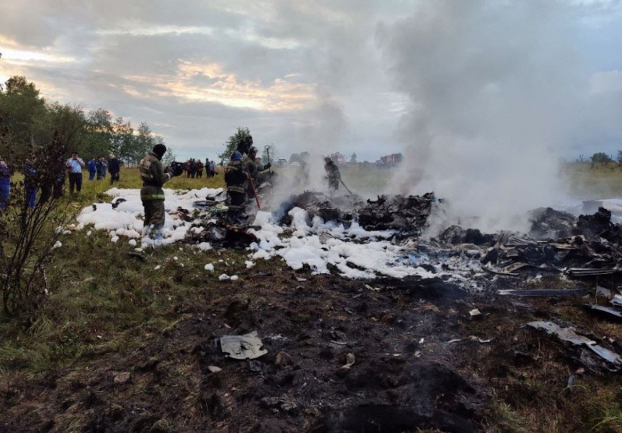 Firefighters work at an aircraft wreckage following the crash of a private jet in the Tver region, Russia on Wednesday.