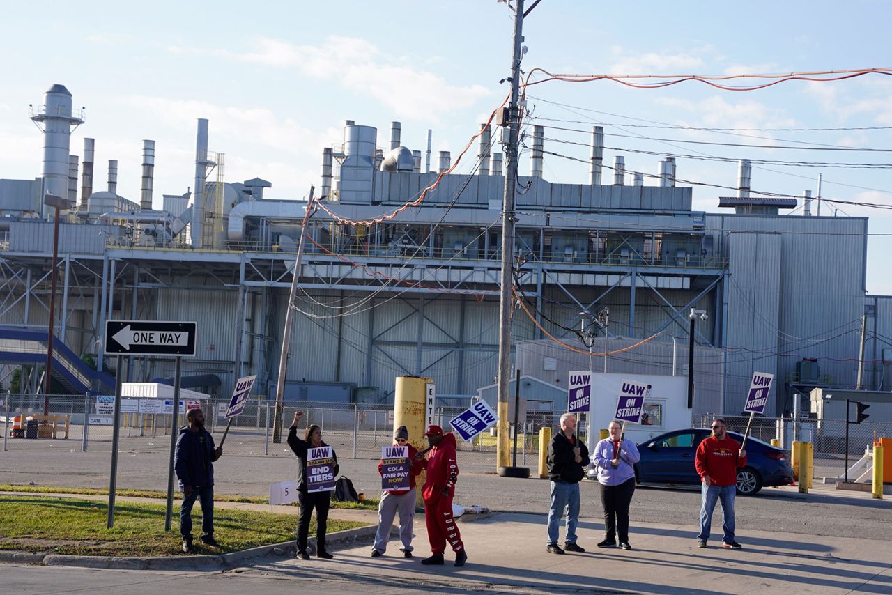 Members of the United Auto Workers union (UAW) gather in front of the Ford Michigan Assembly Plant during the first day of strike in Detroit, Michigan, on September 15. 