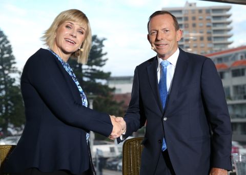 Warringah candidates Tony Abbott and Zali Steggall shake hands at the beginning of a debate on May 2, 2019 in Sydney.