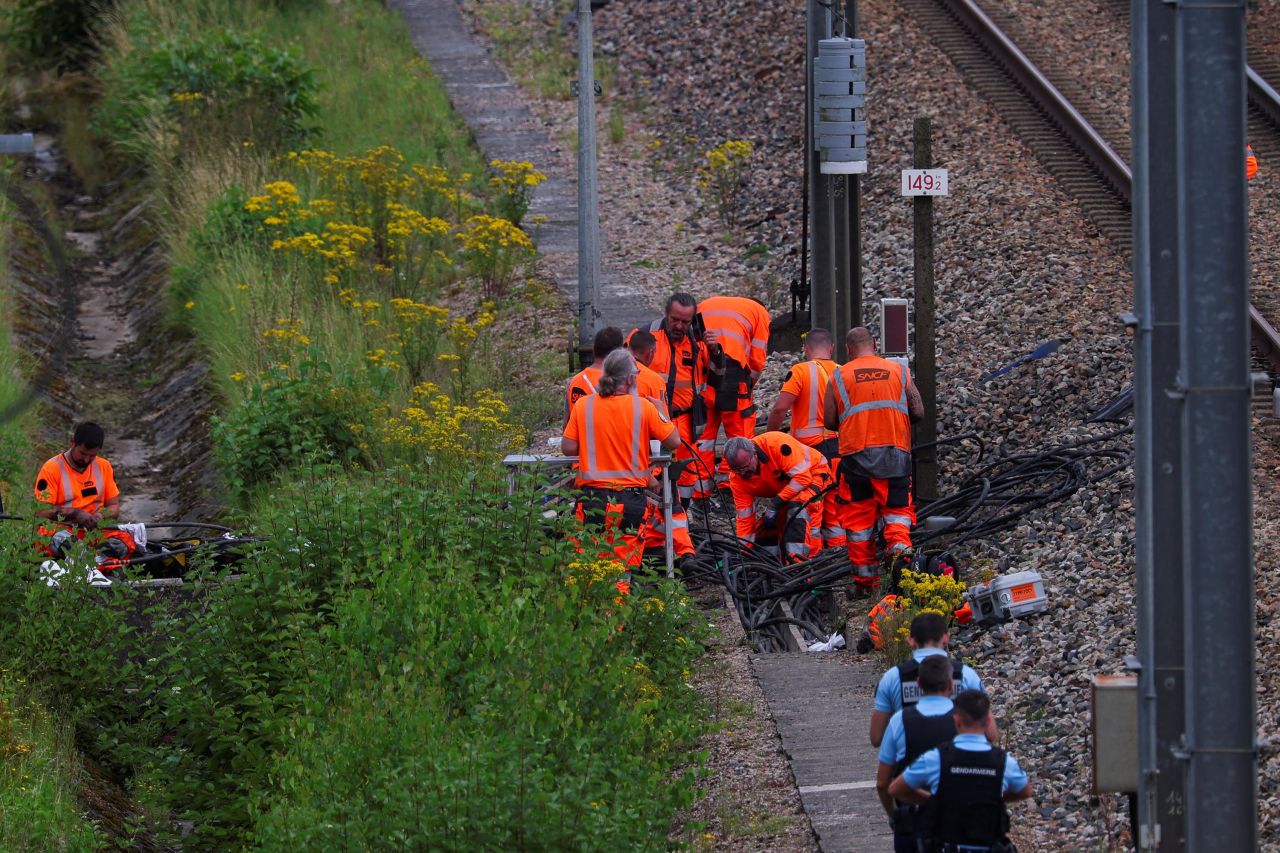 SNCF railway staff and police officers work at the site where vandals targeted France's high-speed train network in Croisilles, France, on Friday, July 26.