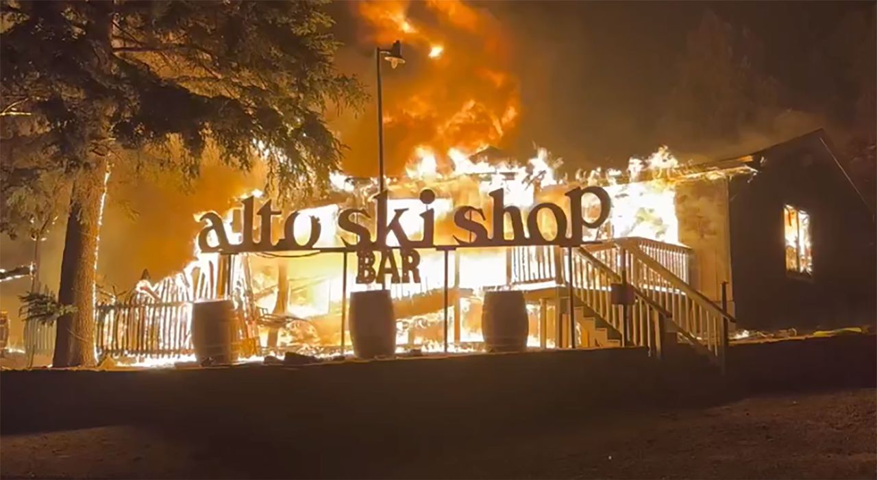 Alto Ski Shop Bar is seen engulfed in flames in Alto, New Mexico, on June 18.