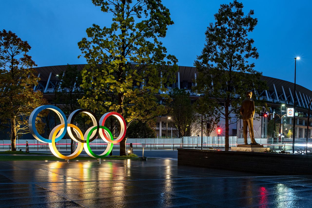 The Olympic Rings are displayed before the National Stadium in Tokyo on April 20. 