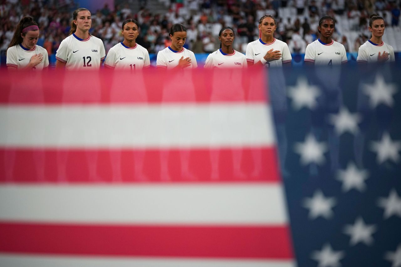 The US women's national team stands during their national anthem before a match on Sunday.