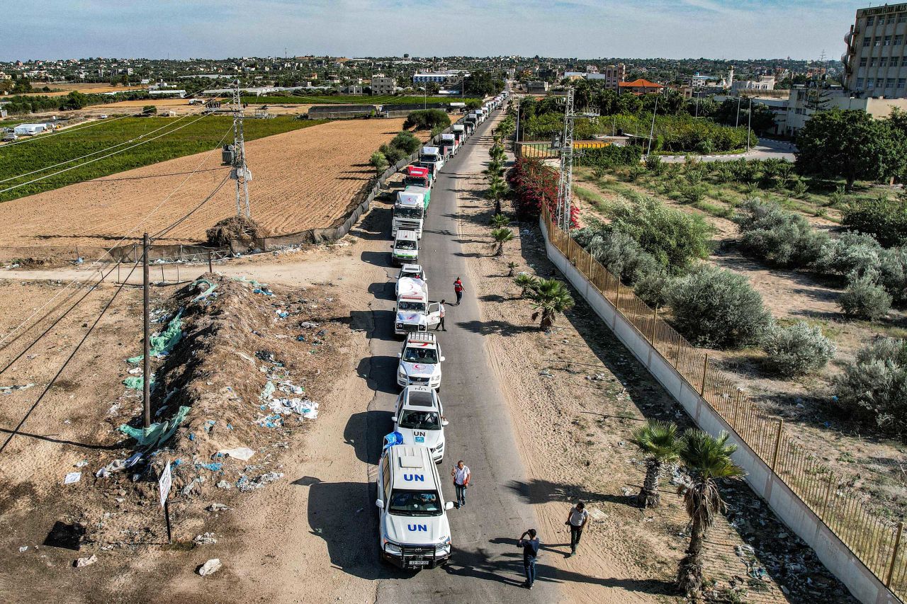 An aerial view shows humanitarian aid trucks arriving in Khan Younis, Gaza, after crossing the border from Egypt, on October 21.