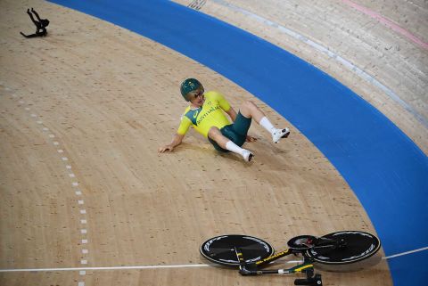 Australia's Alexander Porter reacts after crashing during the men's track cycling team pursuit qualifying event in Izu, Japan, on Monday.