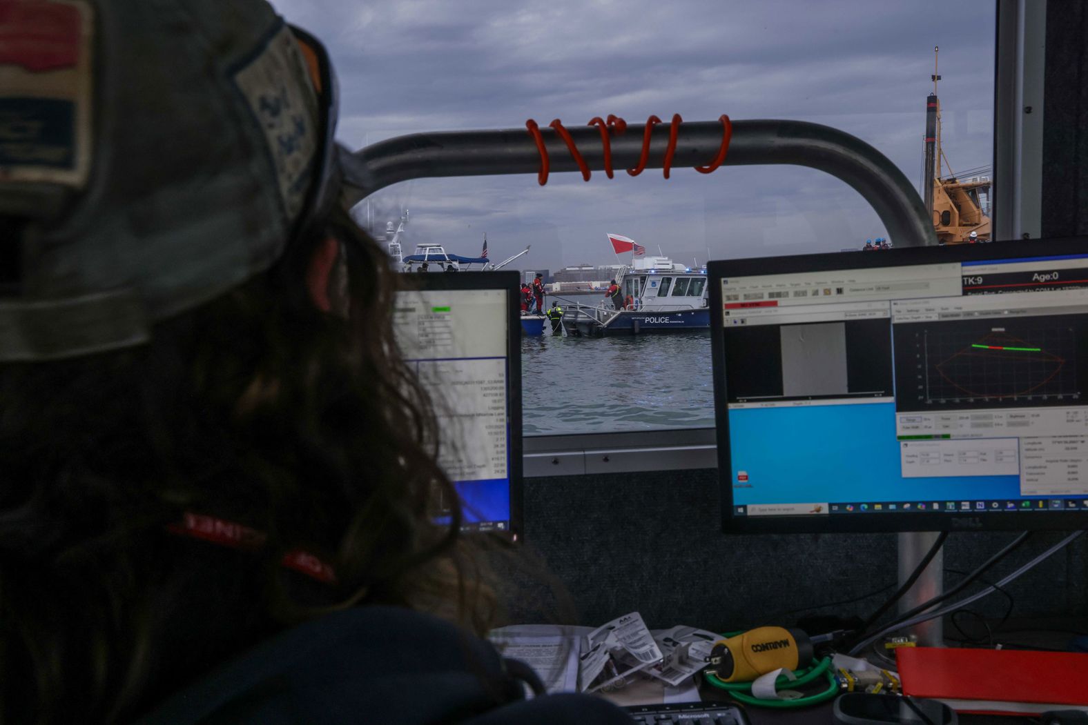 Vessels with the US Army Corps of Engineers assist in salvage operations.