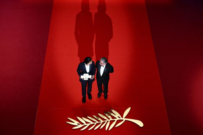 Actress Nadia Melliti, left, receives the Best Actress award from actor Daniel Auteuil during <a  target="_top" href="/newspapers?url=https://www.cnn.com/2025/05/24/entertainment/palme-dor-cannes-film-festival">the closing ceremony of the Cannes Film Festival</a> in France on Saturday, May 24. Melliti won for her part in the film "La Petite dernière" ("The Little Sister”).