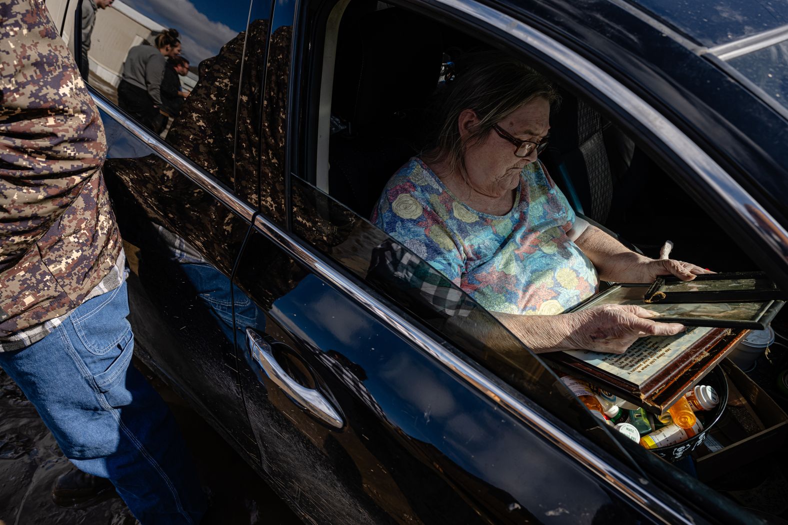 Kathy Kinney looks at photos from her home after a <a href="https://www.cnn.com/2025/02/17/us/deadly-winter-storm-eastern-us/index.html">winter storm caused flooding</a> in Pikeville, Kentucky, on Monday, February 17. More than a month’s worth of rain deluged much of Kentucky in less than 24 hours.