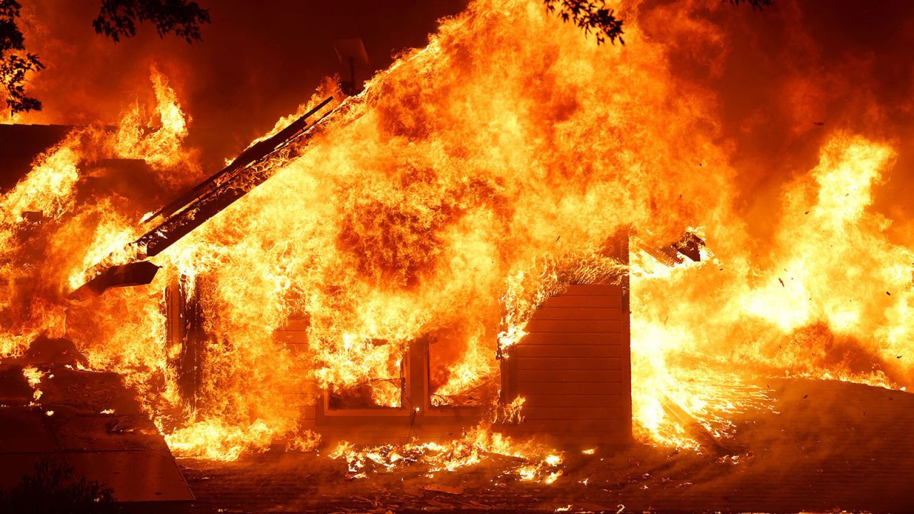 A burning house is seen as Park Fire burns near Chico, California, U.S. July 25, 2024. REUTERS/Fred Greaves