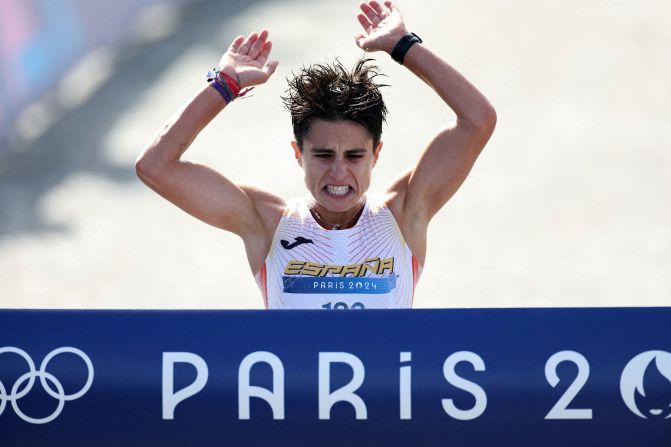 Spain's María Pérez crosses the finish line <a >to win gold in the marathon mixed relay race walk</a> on August 7. Her partner was álvaro Martín.