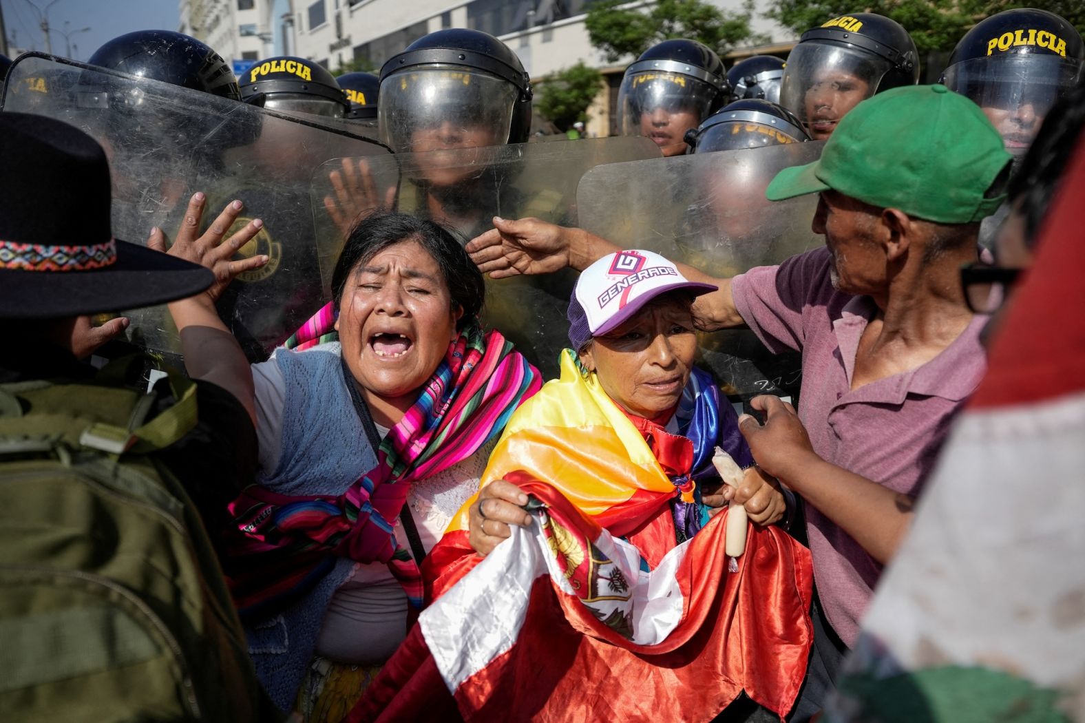 Police officers clash with demonstrators near the National Congress in Lima, Peru, as members of unions and social organizations take part in a three-day national strike on Wednesday, November 13. The strike is taking place while world leaders are in Lima for a summit of the Asia-Pacific Economic Cooperation forum.