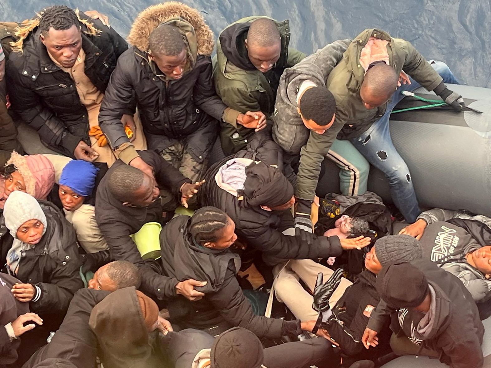 A migrant holds a baby girl who was <a href="index.php?page=&url=https%3A%2F%2Fwww.cnn.com%2F2025%2F01%2F09%2Feurope%2Fbaby-born-migrant-boat-spain-intl%2Findex.html">born on a dinghy</a> traveling from Africa to Spain on Monday, January 6. Rescue workers from Spain’s Canary Islands encountered the inflatable raft off the coast of the island of Lanzarote. They told local media they believed the mother had given birth at sea just 15 minutes before.