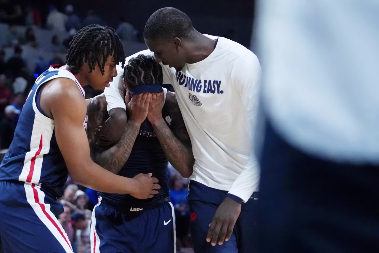 Gonzaga guard Khalif Battle is consoled after their loss to Houston.