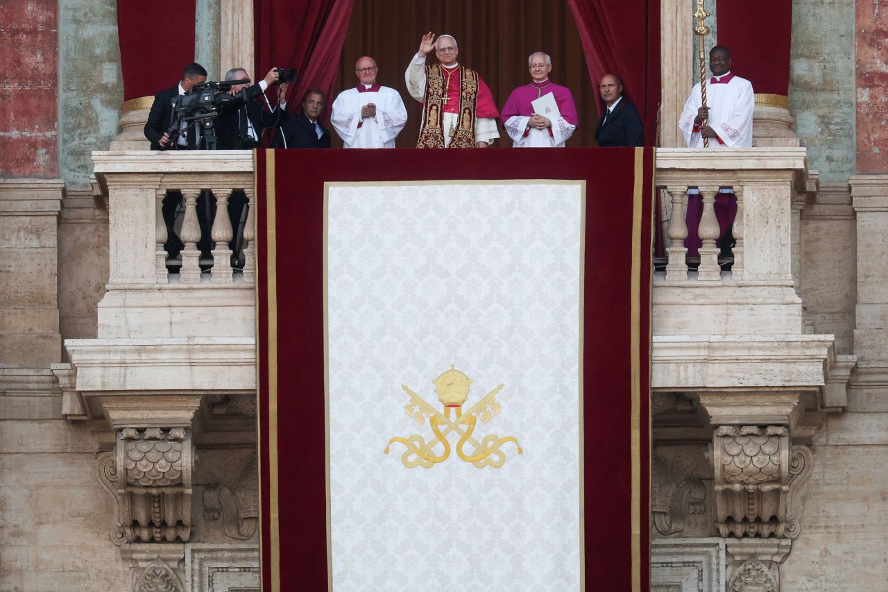 Pope Leo XIV appears on the balcony of St. Peter's Basilica.