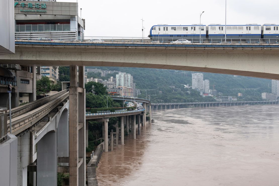 Floodwater flows through urban areas in Chongqing on July 12, 2024.