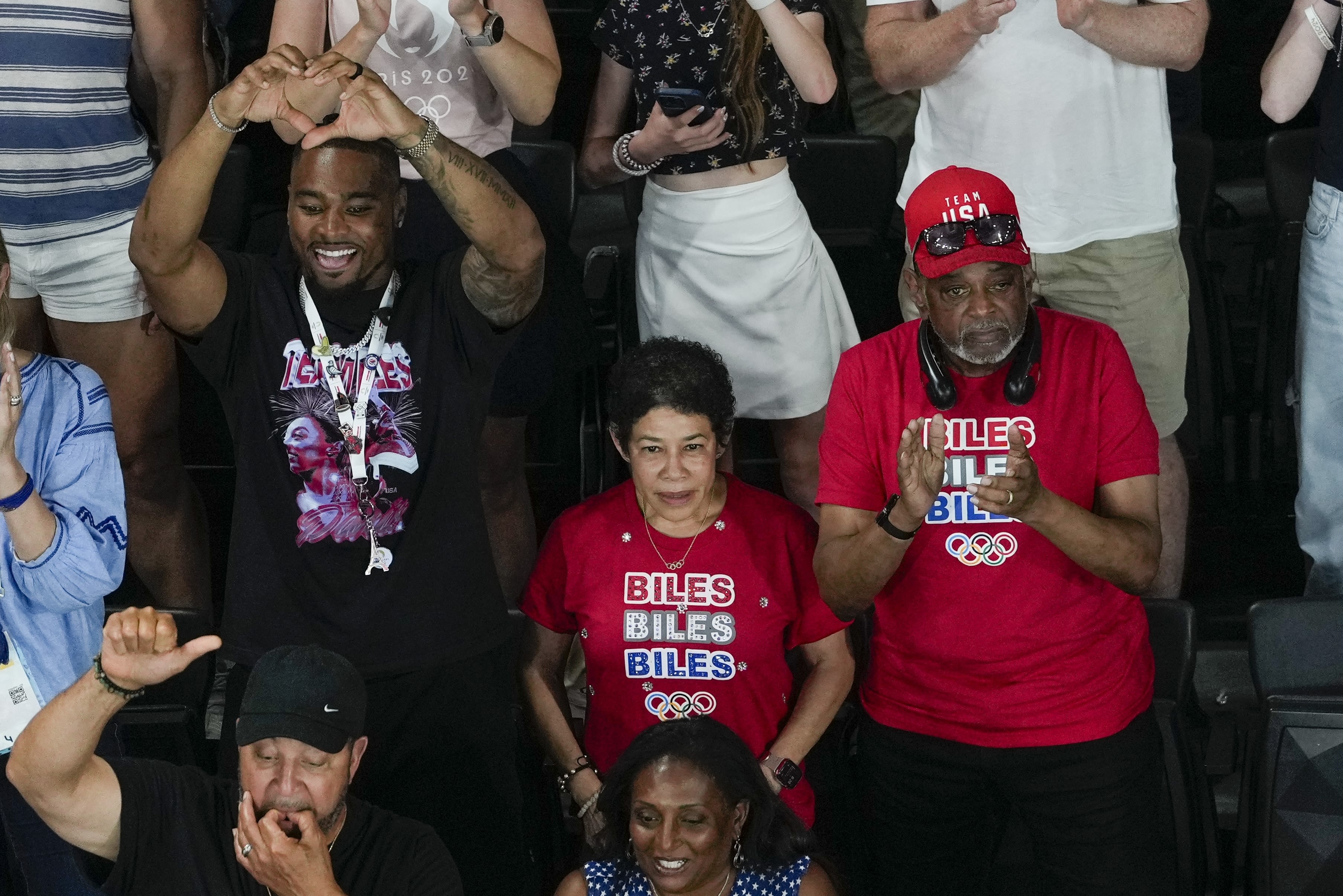 Biles is cheered on by her husband, Jonathan Owens, and her parents, Ron and Nellie Biles.