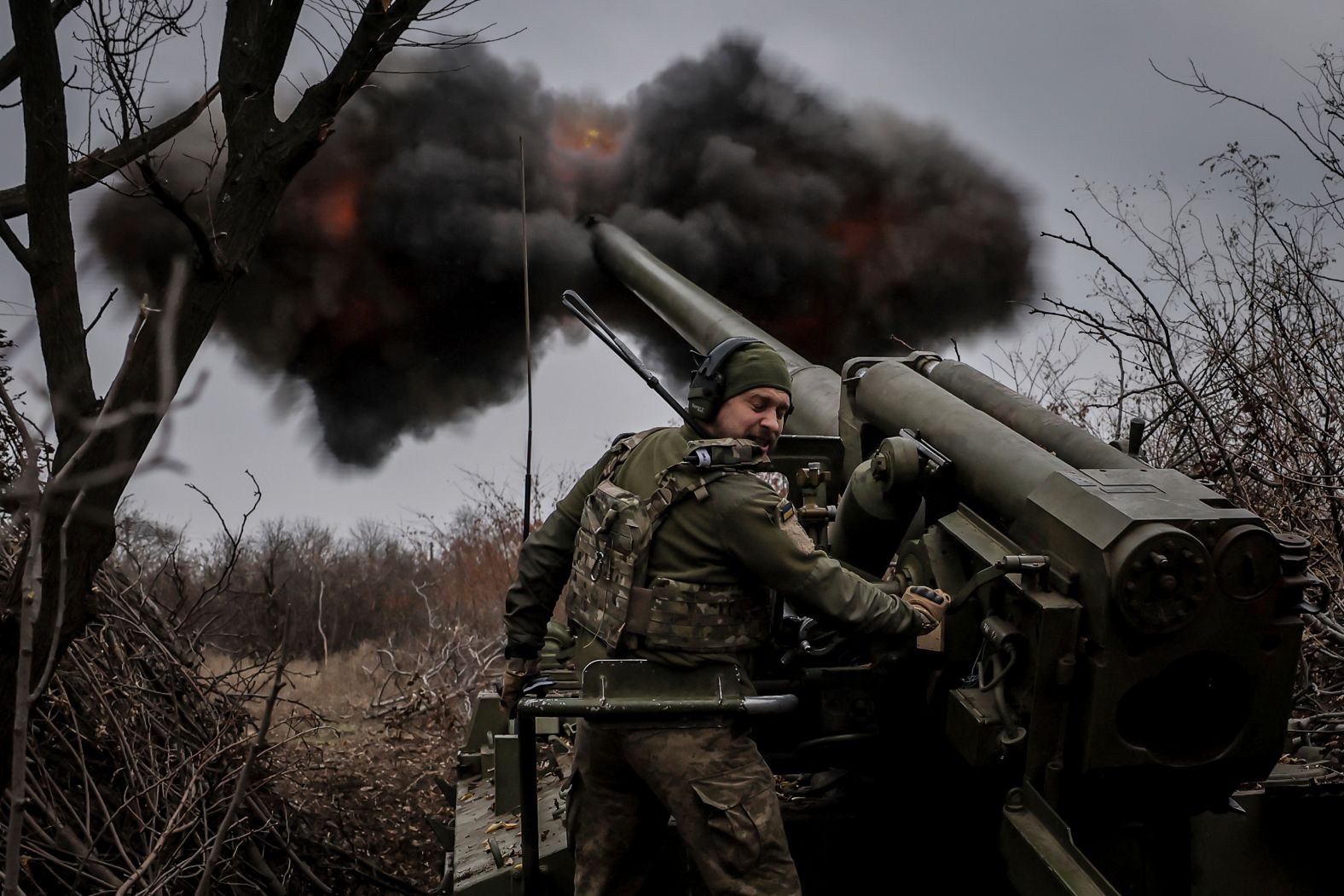 Ukrainian servicemen fire a howitzer toward Russian positions near Chasiv Yar, Ukraine, on Monday, November 18.