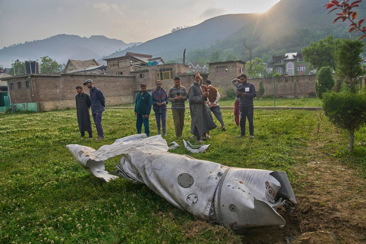 The debris of a downed aircraft lies in the compound of a mosque at Pampore, India-administered Kashmir. Pakistan claimed it shot down <a href="https://www.cnn.com/world/live-news/india-pakistan-attack-kashmir-tourists-intl-hnk#cmad6m6dr00123b6ptf085nzt#cmad6m6dr00123b6ptf085nzt#cmad6m6dr00123b6ptf085nzt">five Indian Air Force jets and a drone</a>. India has not confirmed the fighter jet losses.