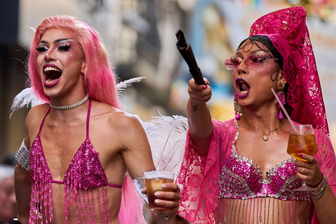 People in drag take part in festivities ahead of the annual high heel race.