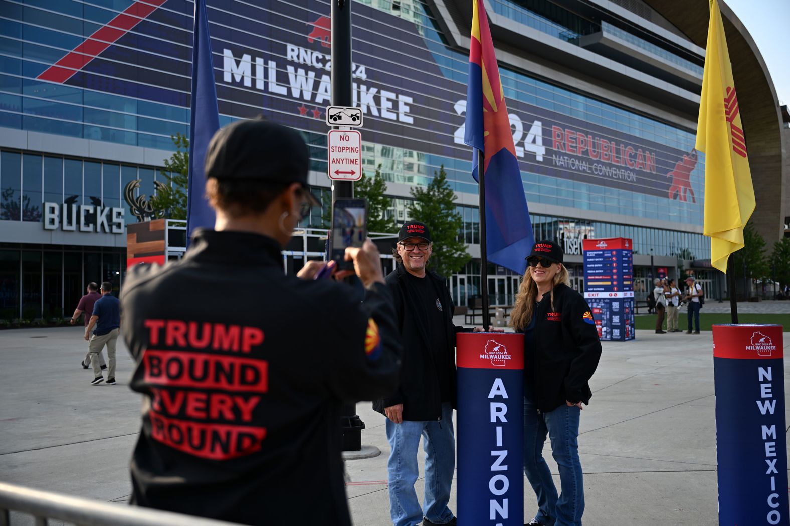 Arizona delegates pose for pictures in front of the Fiserv Forum on Saturday.