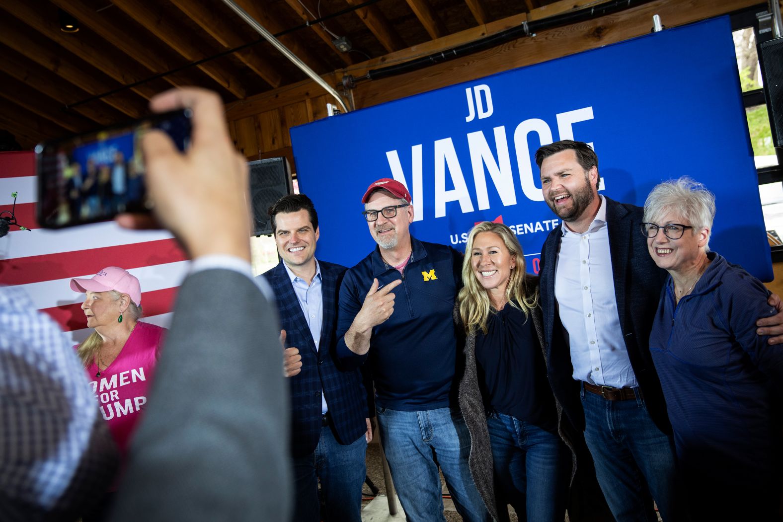 Vance, second from right, joins US Reps. Matt Gaetz, left, and Marjorie Taylor Greene, center, as they take pictures with supporters at a campaign rally in Newark, Ohio, in April 2022.