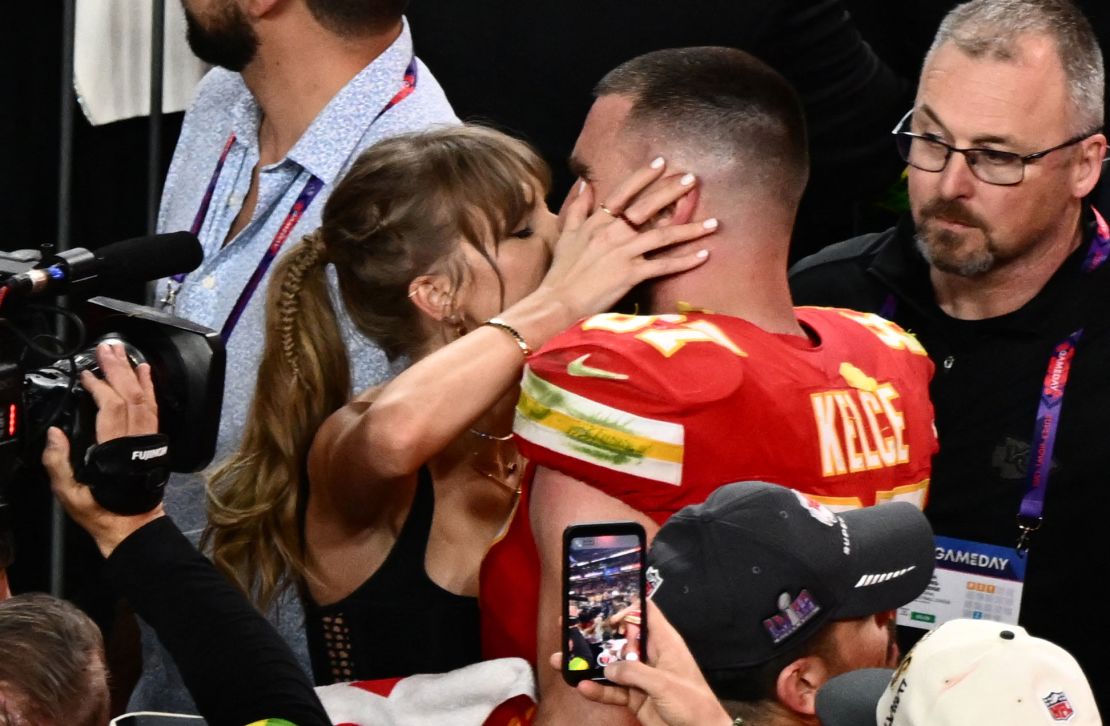 Taylor Swift kisses Kansas City Chiefs' tight end #87 Travis Kelce after the Chiefs won Super Bowl LVIII against the San Francisco 49ers at Allegiant Stadium in Las Vegas, Nevada, February 11, 2024.