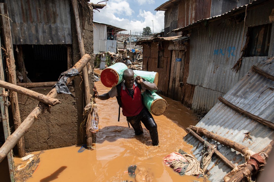 A resident of Mathare slum in Nairobi trying to salvage possessions following deadly flooding in the capital on April 24.