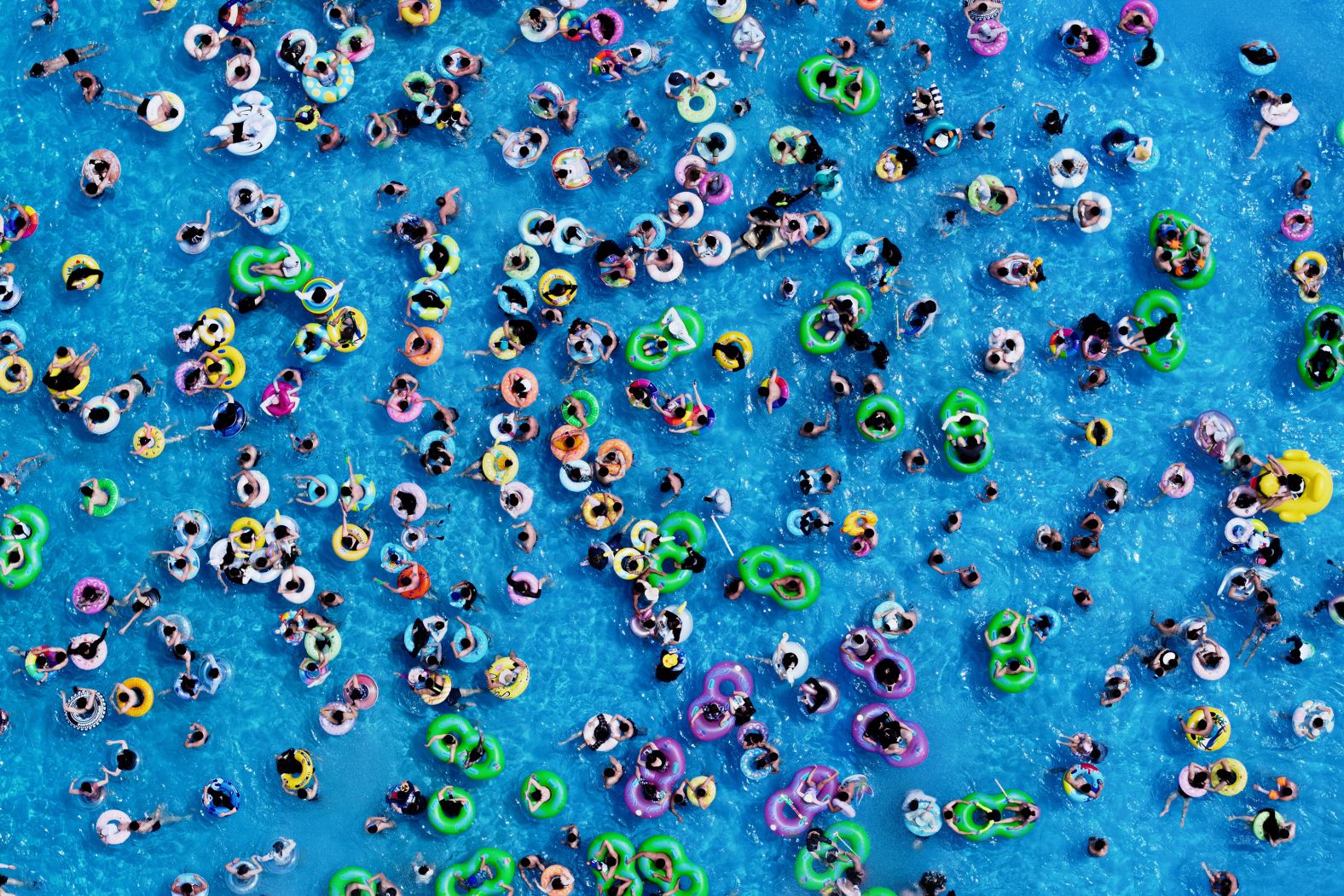 This aerial photo, taken on Sunday, June 9, shows people cooling off at a water park in Nanjing, China.