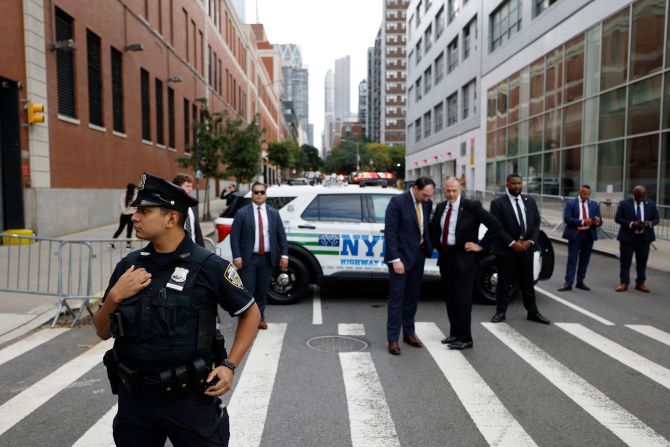 New York police officers and Secret Service agents stand outside the debate site ahead of the debate.