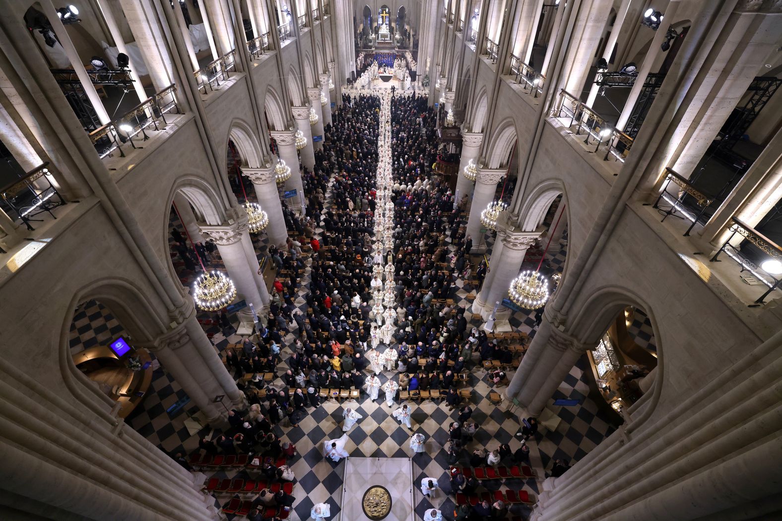 Members of the clergy walk towards the new main altar after the first Mass on December 8.