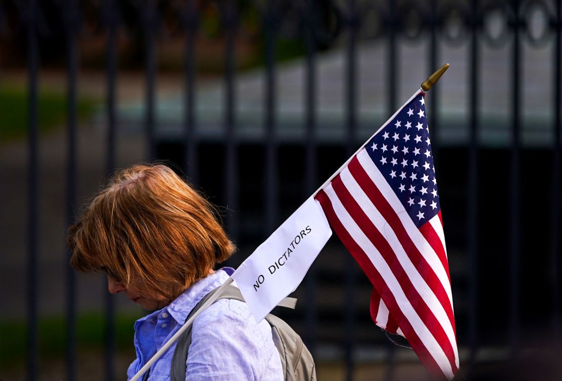 A woman attends a protest against the Trump administration's moves against Harvard's international students on Tuesday.
