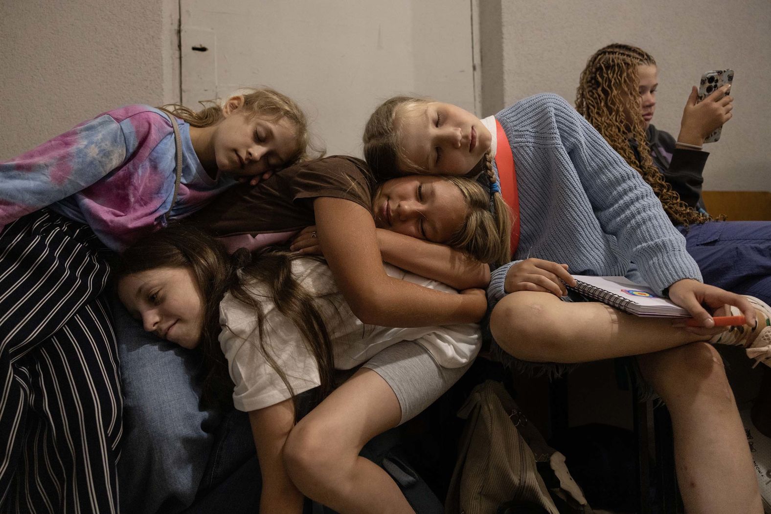 Children rest in a school shelter in Kyiv, Ukraine, during an air alert that lasted more than three hours on Tuesday, September 2.