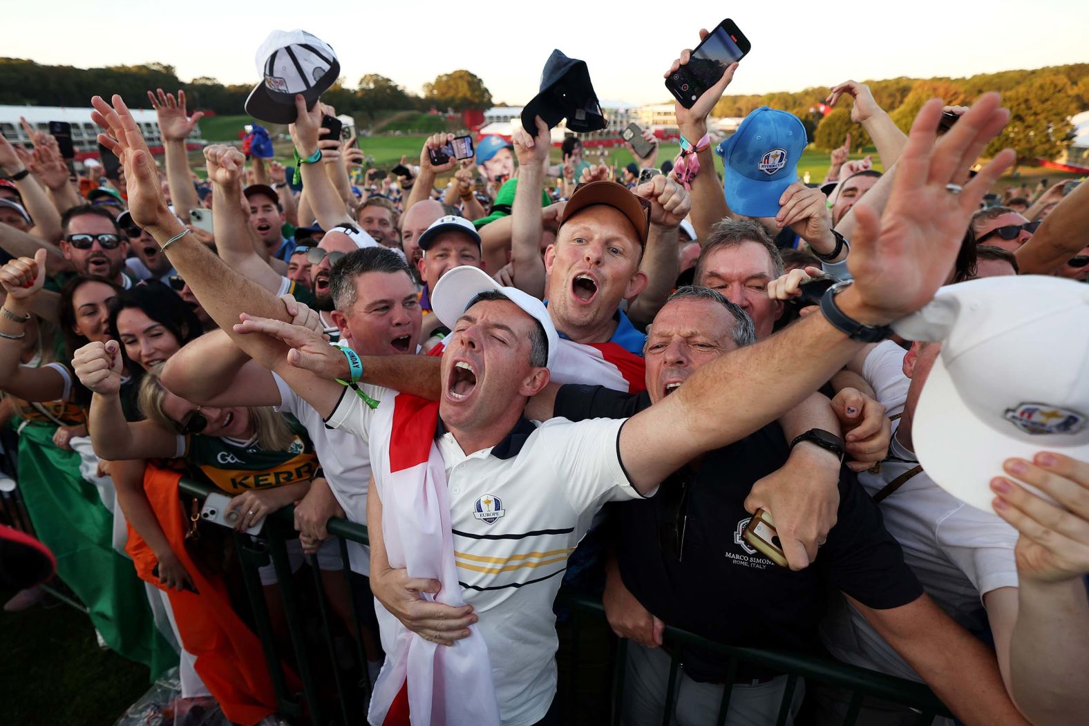 Rory McIlroy celebrates with fans after Team Europe's 15-13 win over Team America during the trophy presentation ceremony of the 2025 Ryder Cup in Farmingdale, New York, on Sunday, September 28.