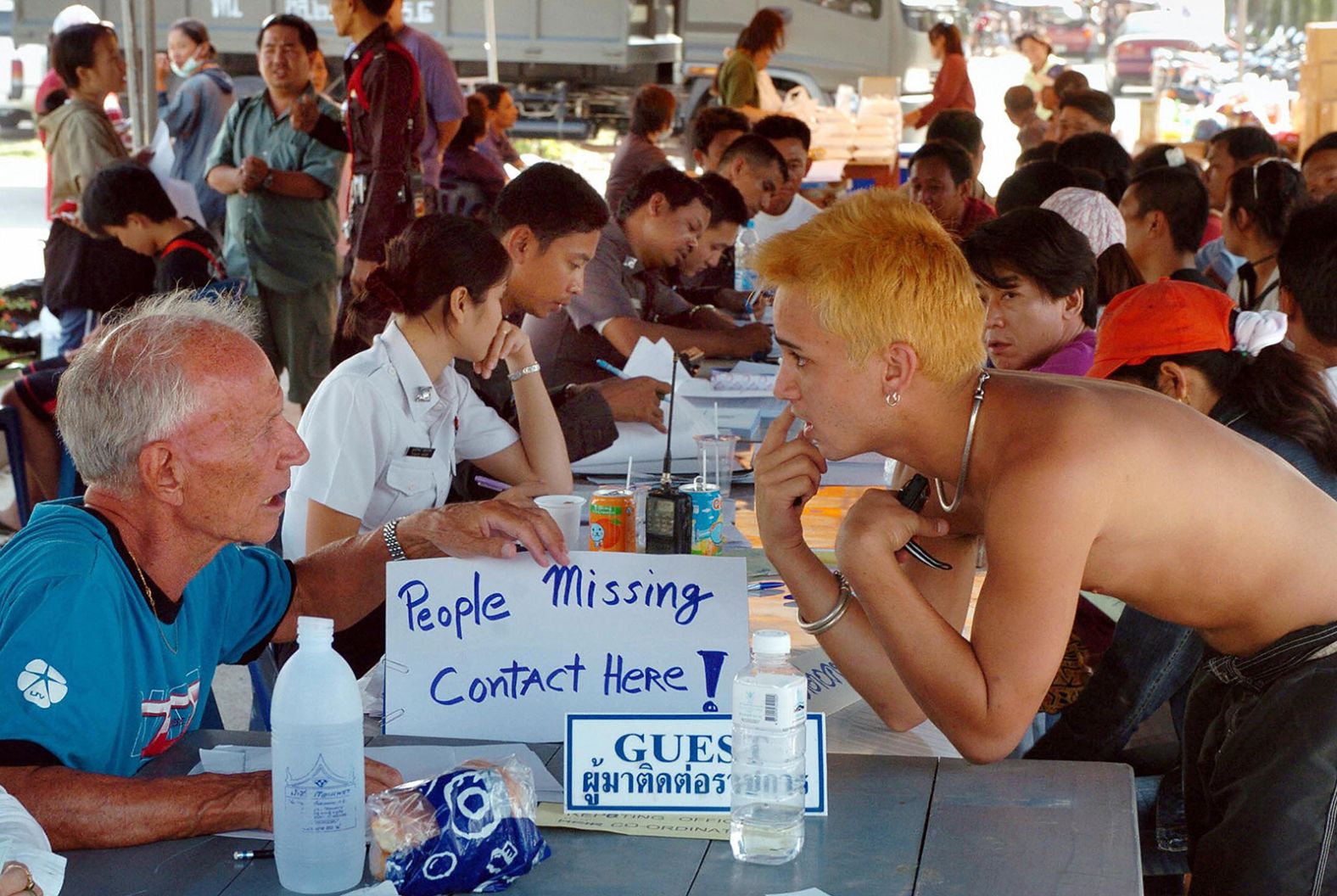 Outside a government hospital on Thailand's Phuket Island, volunteers assist people who were looking for missing relatives in the aftermath of the tsunami.