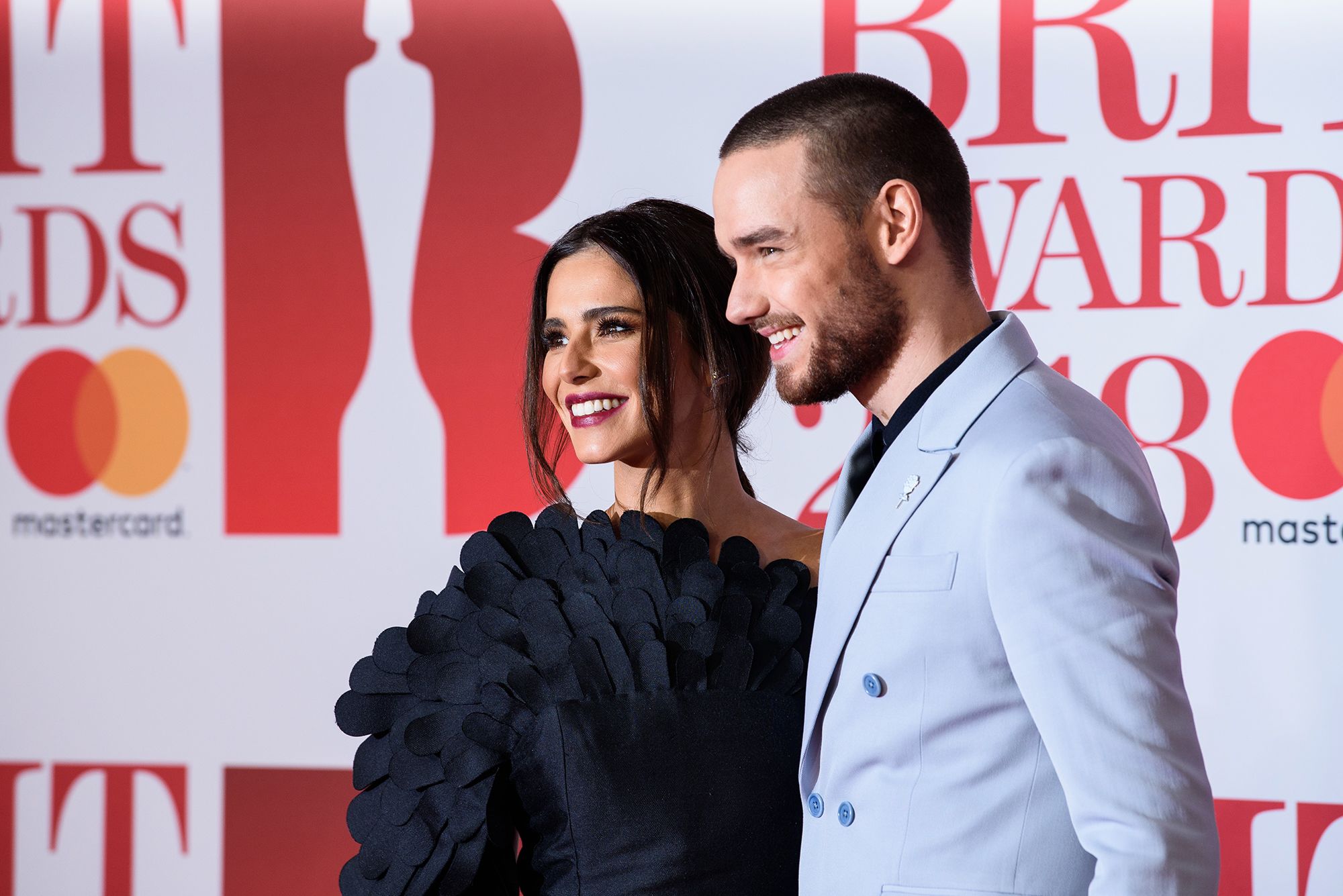 Payne poses for photos with his then partner Cheryl Cole at the 2018 BRIT Awards in London.