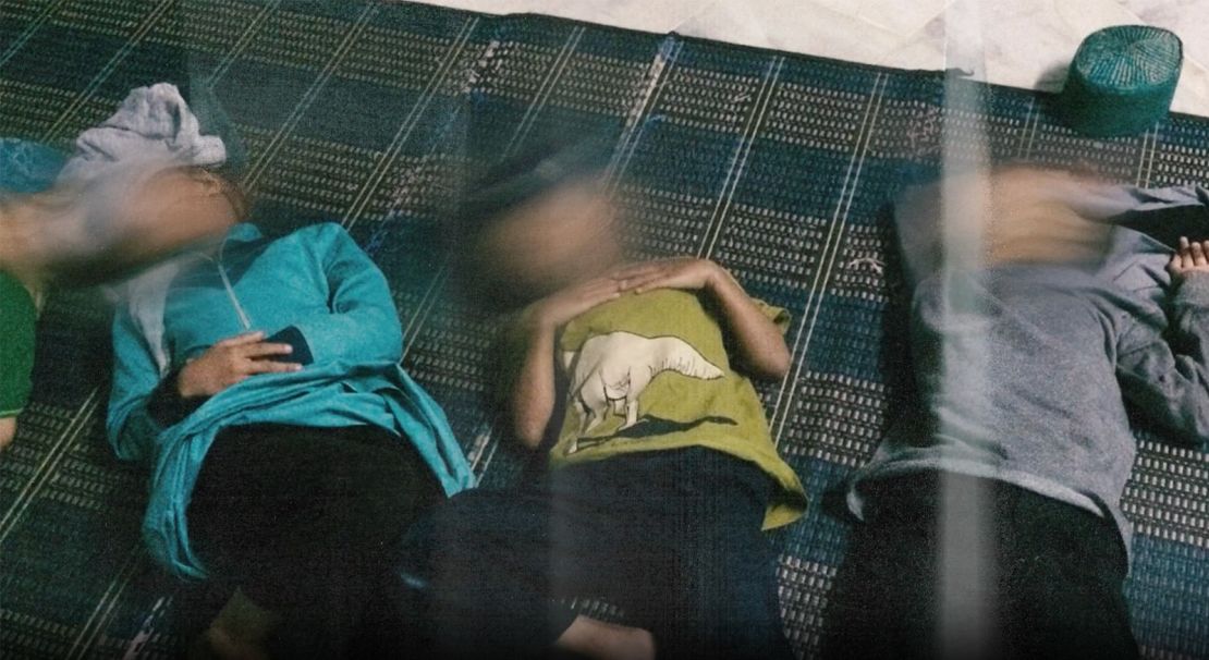 Young boys sleeping on a thin mat at a GISBH run care home.